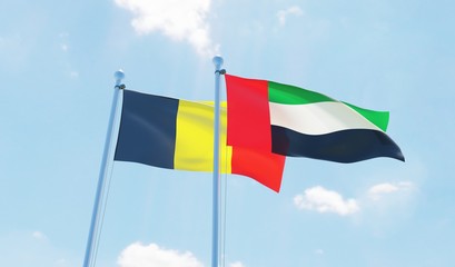 UAE and Belgium, two flags waving against blue sky. 3d image