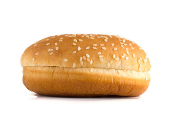 Burger bun on a white background. Bun cut in half close up on a white background.