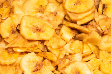 Banana chips, slices of fresh ripe bananas as food background