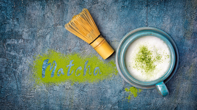 Fototapeta Lettering from green matcha tea with popular healthy latte and bamboo whisk