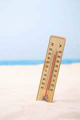 Weather thermometer in the sand