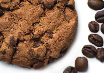 Top view, chocolate chip cookies and  the best Roasted Coffee Beans from Brazil. White background. From above.