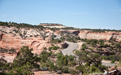 Road uphill with many bends in American desert mountains