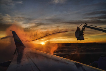 De-Icying a jet during sunset
