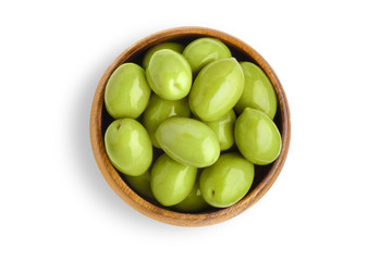 Delicious big green olives in a wooden bowl, isolated on white background, view from above