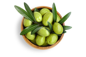 Delicious big green olives with leaves in a wooden bowl, isolated on white background, view from above