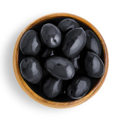 Delicious big black olives in a wooden bowl, isolated on white background, view from above