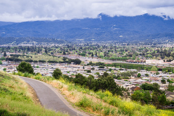Running Trail on Communications hill; residential neighborhood in the background, San Jose,...