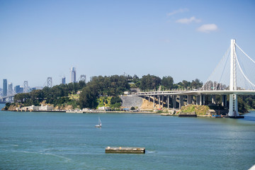 Yerba Buena Island and the Bay Bridge, San Francisco downtown in the background, California