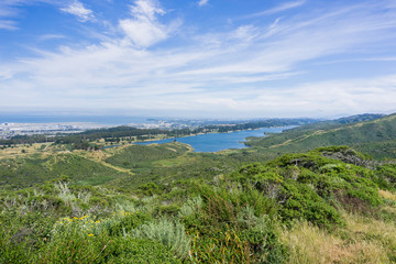 Fototapeta na wymiar View towards San Andreas reservoir; the towns of San Francisco bay in the background, California