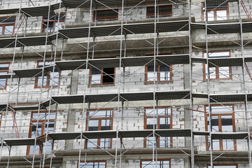 new building under construction, scaffolding and concrete