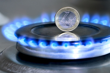 Burning natural gas and one euro coin on gas hob - obrazy, fototapety, plakaty