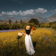 bride in back with flowers at mountain view