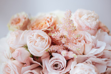 Wedding flowers, bridal bouquet closeup. Decoration made of roses, peonies and decorative plants, close-up, selective focus, nobody, objects