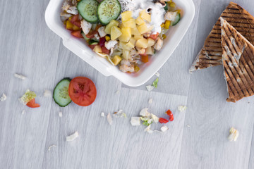 fast food vegetable salad with pineapple and cucumber in box