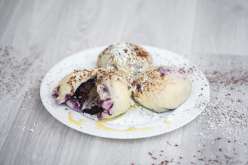 Czech or European typical meal, sweet stuffed dumplings, often with plum, strawberry or another...