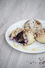 Czech or European typical meal, sweet stuffed dumplings, often with plum, strawberry or another...