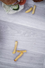 fast food snack to take away, unhealthy dish to eat,  mix of food, potato french fries, beef meat