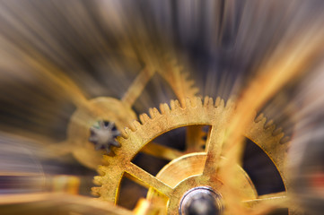Metal Cogwheels in clock mechanism , abstract sun beams, Concept Movement is life, Teamwork , Idea...