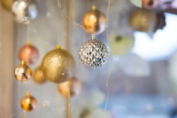 Christmas decoration in the shop windows. Christmas tree balls	