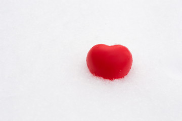 Fototapeta premium White red heart in snow. Valentine's day and love concept. Copy space for text.