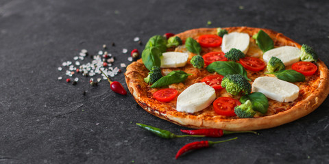 pizza with vegetables and cheese (broccoli, mozzarella basil and others). food background