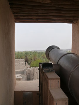 typical expample of defensive arabian architecture with cannon at Jibreen Castle (Jabrin), Oman, Middle East