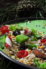 Festive Christmas breakfast bowl. Christmas tree branches and Christmas decorations.