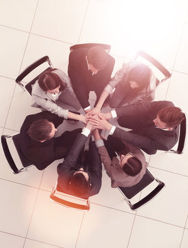 top view.a team of like-minded people sitting in a circle
