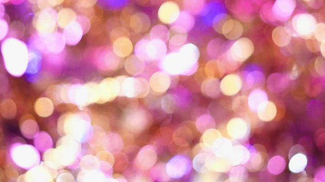 Background video full of unsharp golden and pink shining bokeh blurring gradation design.