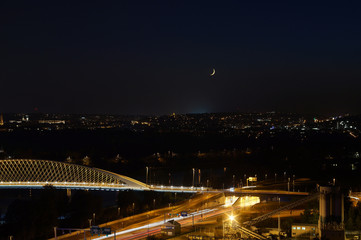 Fototapeta na wymiar Moon shining above Prague, Czech republic.