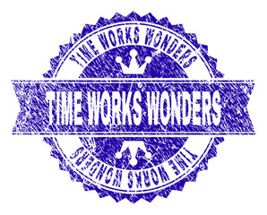 Obraz premium TIME WORKS WONDERS rosette stamp watermark with distress style. Designed with round rosette, ribbon and small crowns. Blue vector rubber watermark of TIME WORKS WONDERS text with corroded style.