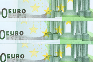 Three one hundred euro banknotes background. High resolution photo close-up macro.