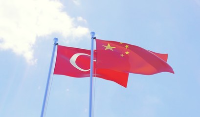 Turkey and China, two flags waving against blue sky. 3d image