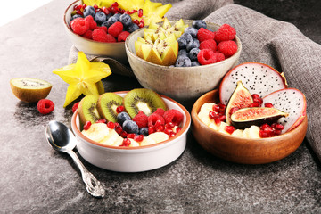 fruit bowl. Bowl of healthy fresh fruit salad on rustic background