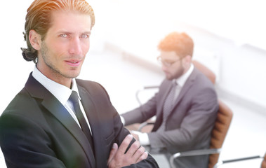 Portrait of businessman standing in office