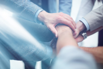 close up.business team putting their hands togeth