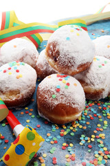 German donuts with jam and icing sugar. Carnival powdered sugar raised donuts