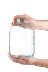 Glass jar in hand on white background