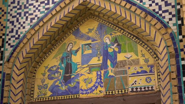 Close up of an arch with painted characters