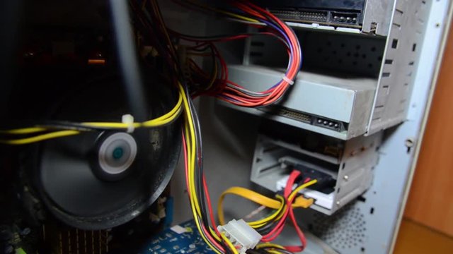 The system unit is working, rotating cooler, spare parts, video card, hard drive