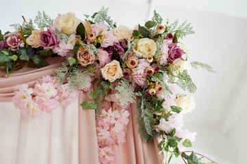 Canopy decorated with flowers .Closely. Pink chiffon