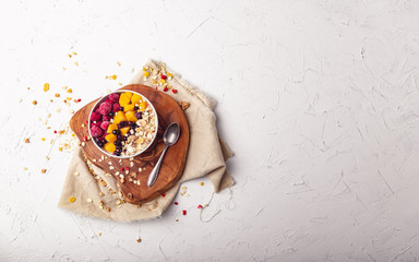 Raspberries, Mango and blueberries in a Bowl. Healthy breakfast concept with yoghurt
