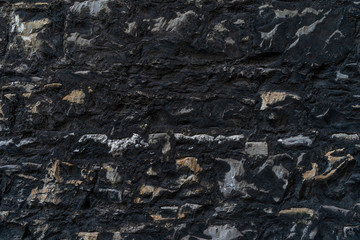Very old black rustic brick wall - high quality texture / background