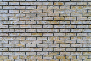 Old gray and yellow rustic brick wall - high quality texture / background