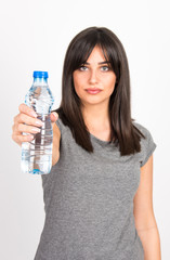 beautiful young girl holding bottle of water