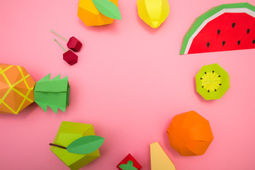 exotic fruits made of paper on pink background