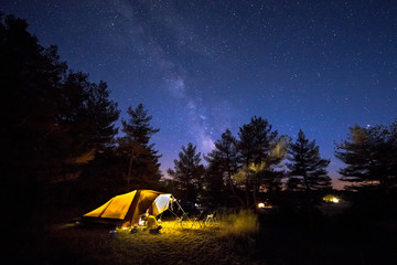 Family tent on camping ground under stars - obrazy, fototapety, plakaty