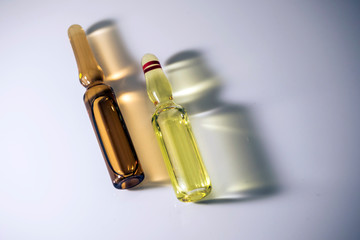 Two vials illuminated laterally, conceptual image