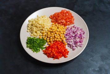 Ingredients for pilaf on a plate. Turkish bulgur pilaf with chickpea.